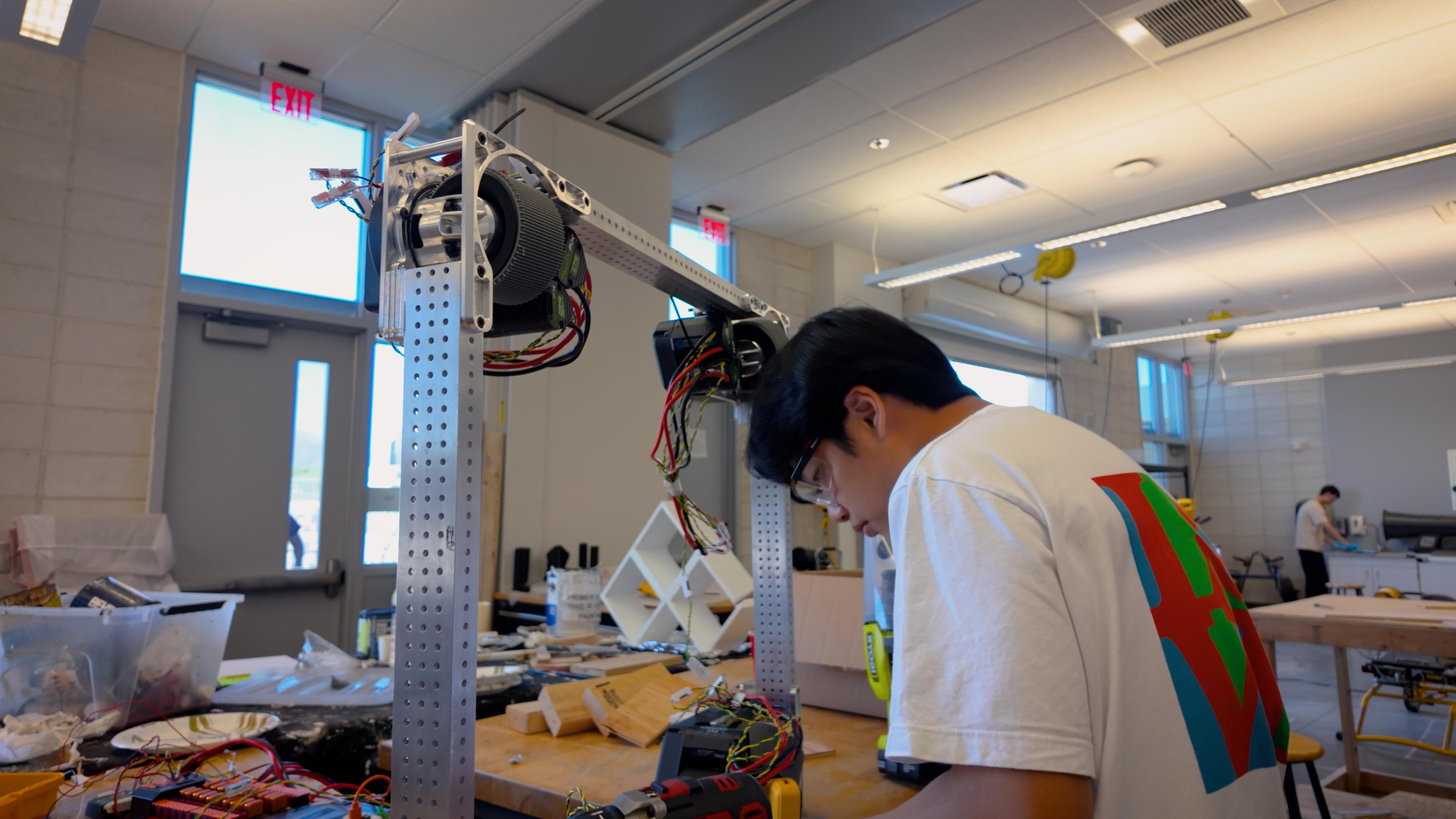A Rōnin Robotics team member working on the 2026 robot in the workshop.