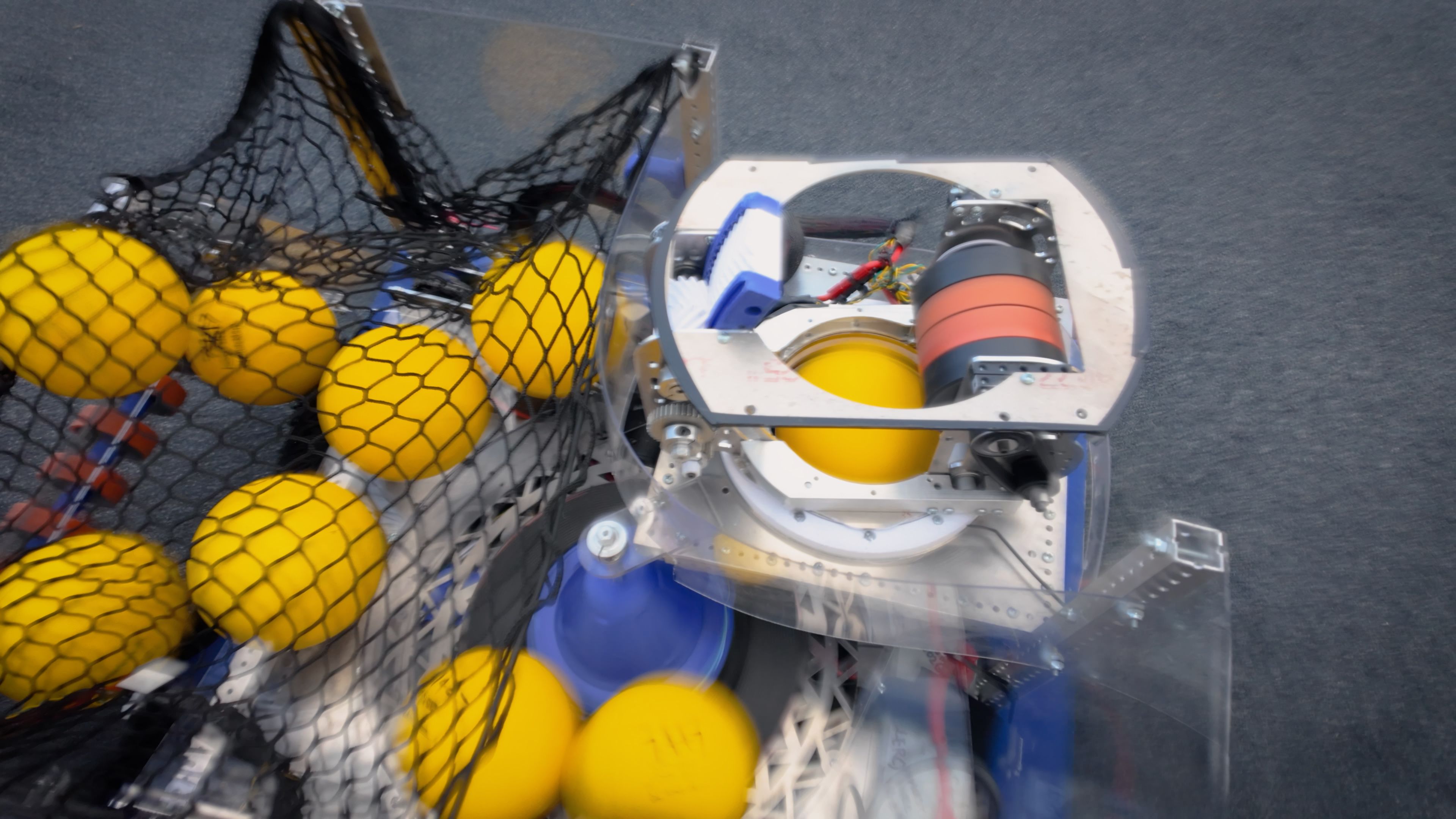 Top-down view of our 2026 robot showing its turret and staged game pieces.